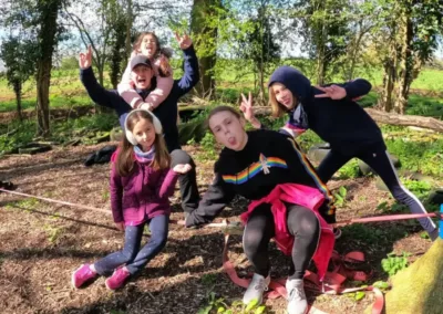 Happy children in a woodland clearing