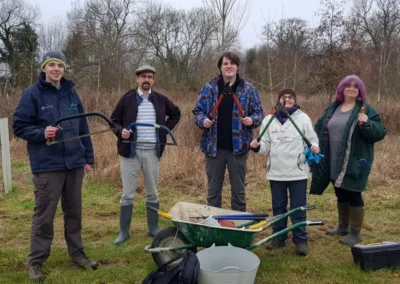Group of people with gardening tools in winter