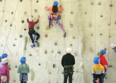 Children climbing on an indoor wall