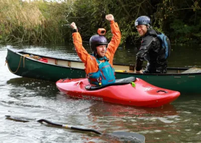 Male in a kayak with a gopro on his helmet