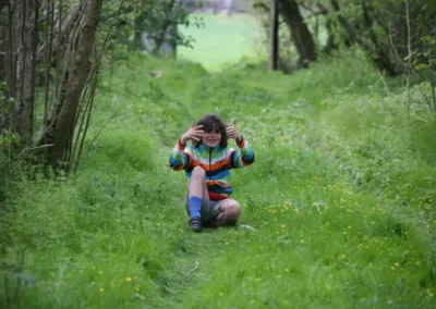 Happy child in a woodland setting