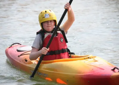 Child in a kayak on the Thames