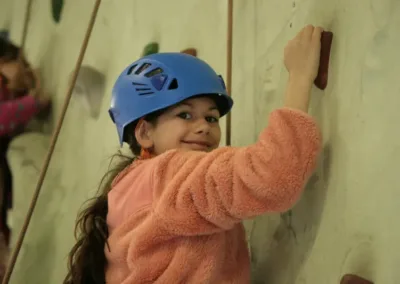 Indoor climbing wall with smiling child