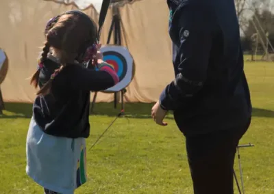 Young girl aiming for a target