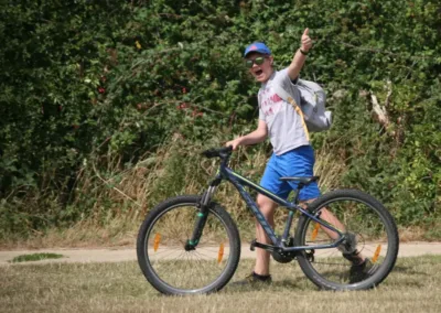 Teen pushing a mountain bike