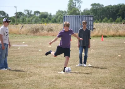 Teens playing football