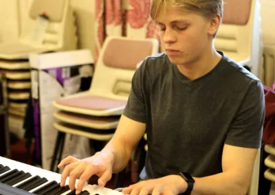 Teen playing the keyboard