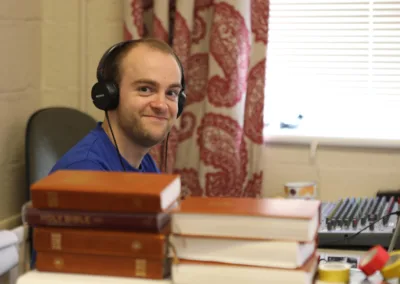 smiling male on the sound desk