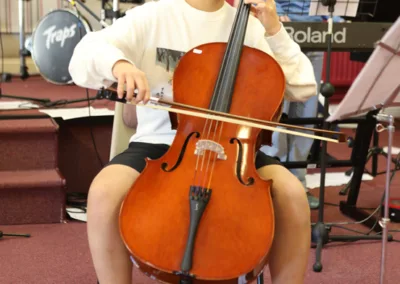 teenager playing a string instrument