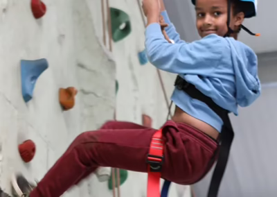 Child on indoor climbing wall