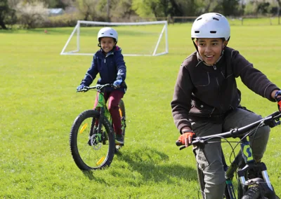 children on mountain bikes in the sunshine