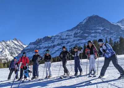 Happy ski group on slopes in Alps