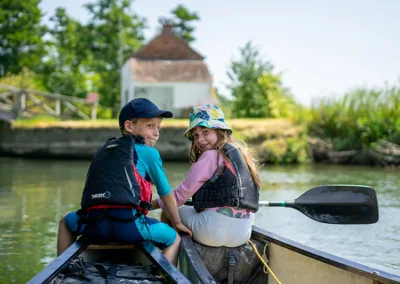 Children at the front of a canoe