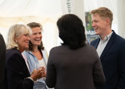 Group of people chatting at an event