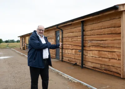 Man and wooden camping facilities