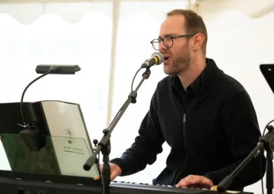 Man singing while playing keyboard